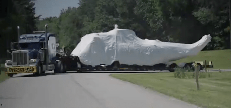 The helicopter is carried by a big rig to the training facility.