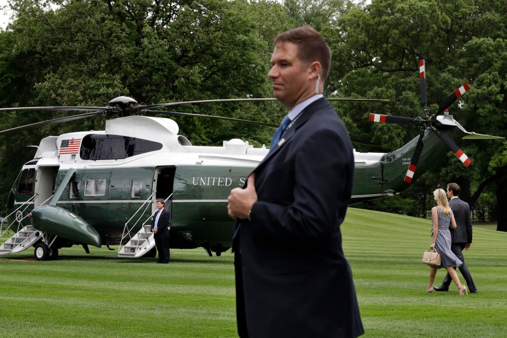 A Secret Service agent stands on the South Lawn of the White House near Marine One on May 4, 2017.
