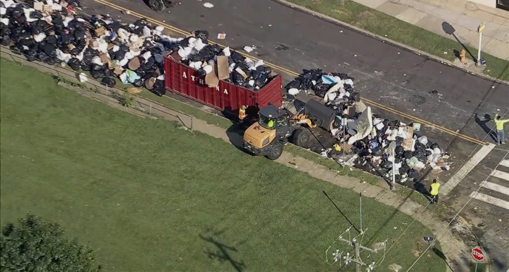 Trash overflows into the streets of Philadelphia on July 8, 2025.