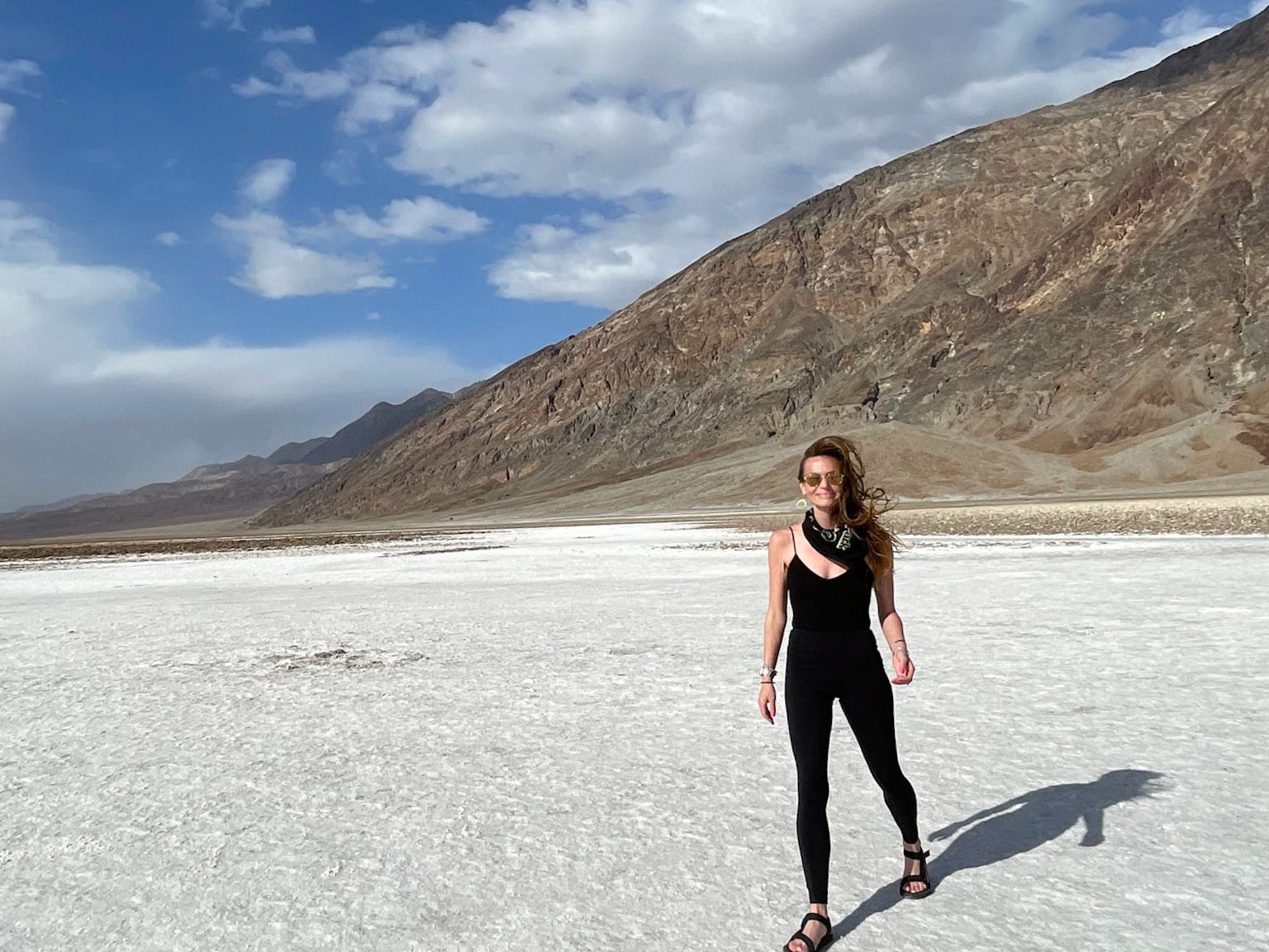 Emily stands on a salt ground in Badwater Basin at Death Valley National Park.