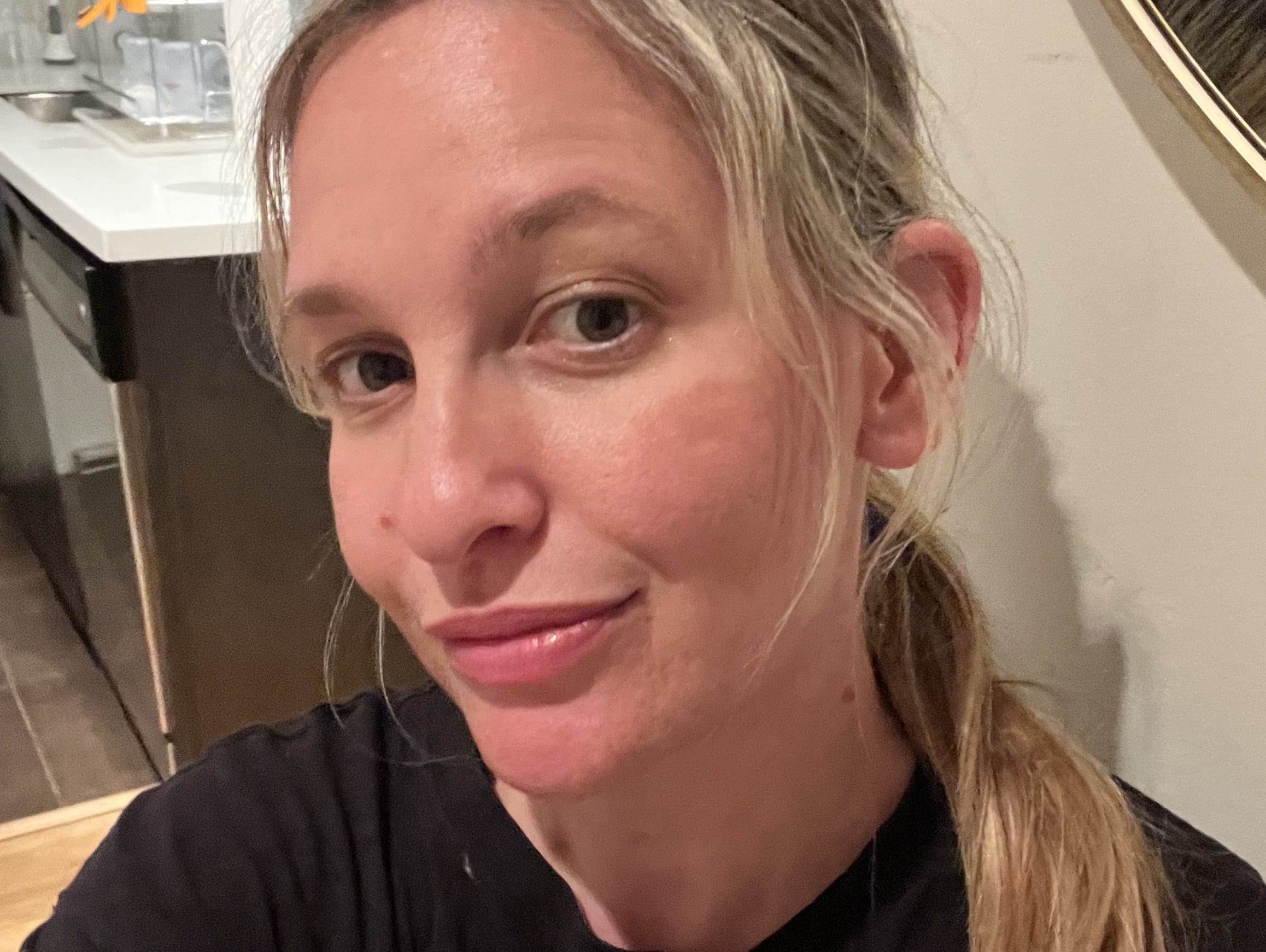 Author taking a selfie after working out and wearing Trader Joe's sunscreen.