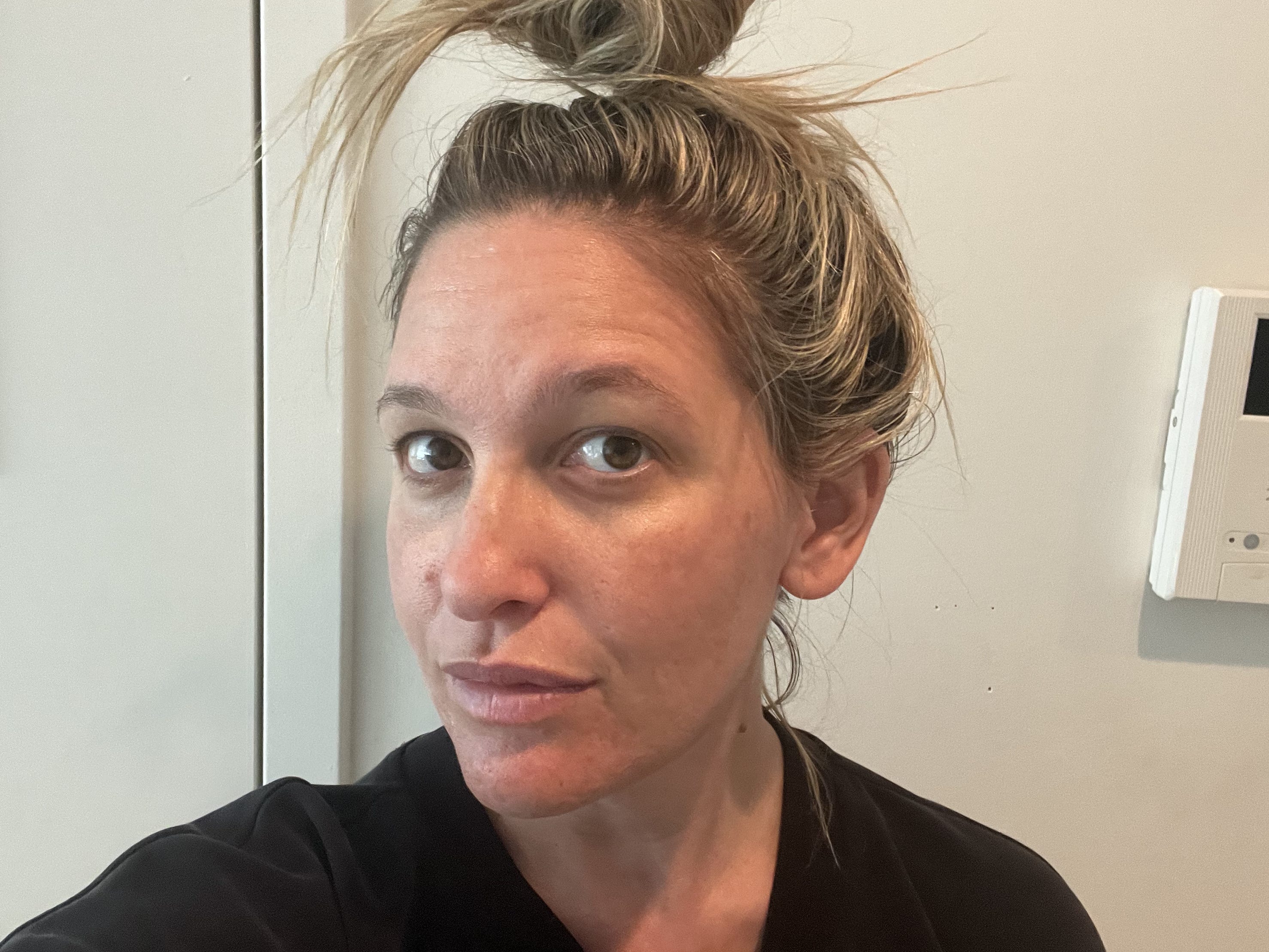 Selfie of author wearing Supergoop sunscreen.