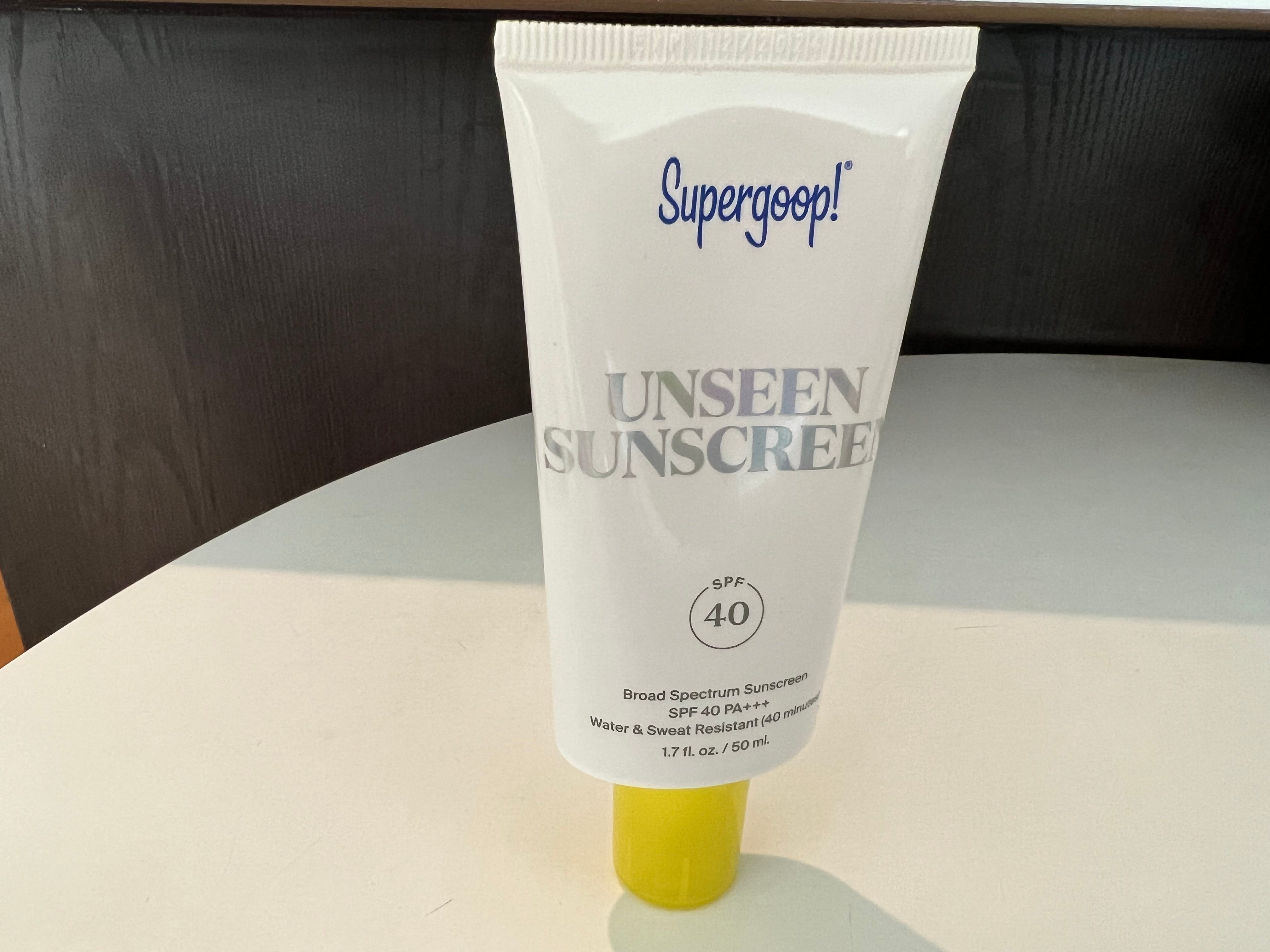 bottle of supergood unsceen sunscreen on a counter