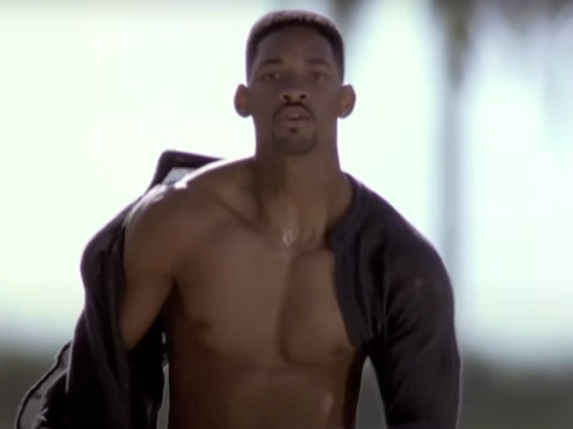 Will Smith wearing an unbuttoned shirt and running in "Bad Boys."