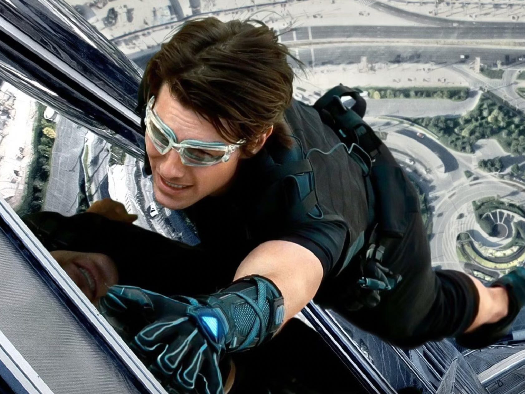 Tom Cruise hanging on the side of the Burj Khalifa in "Mission: Impossible - Ghost Protocol."