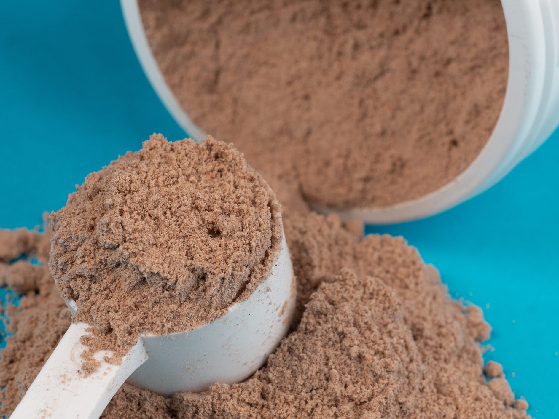 A scoop of chocolate protein powder