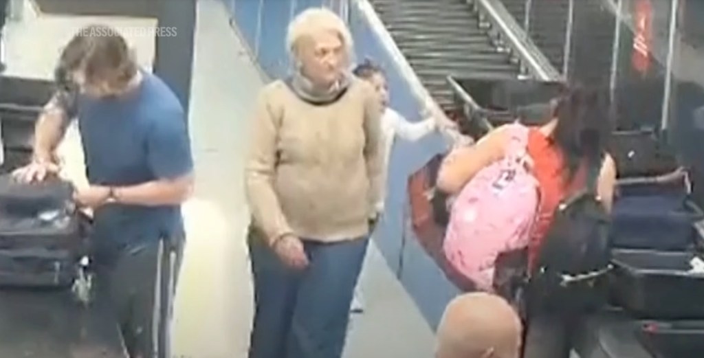 Surveillance video still image of Svetlana Dali boarding a flight without a ticket.