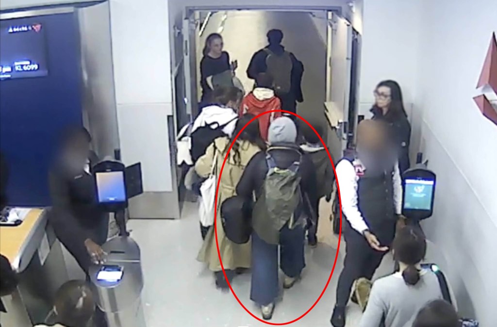 Security camera still image of Svetlana Dali walking through an airport gate.