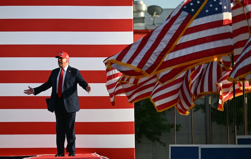 President Donald Trump steps on stage to deliver remarks during a rally at the Iowa State Fairgrounds in Des Moines on July 3, 2025.