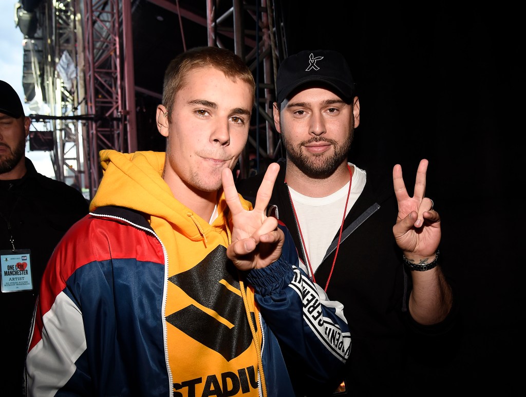 Justin Bieber (L) and Scooter Braun backstage during the One Love Manchester Benefit Concer