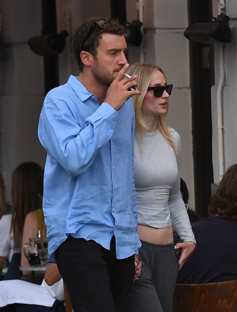 Sophie Turner packs on the PDA with the British aristocrat and boyfriend Peregrine Pearson as they walked in London.
