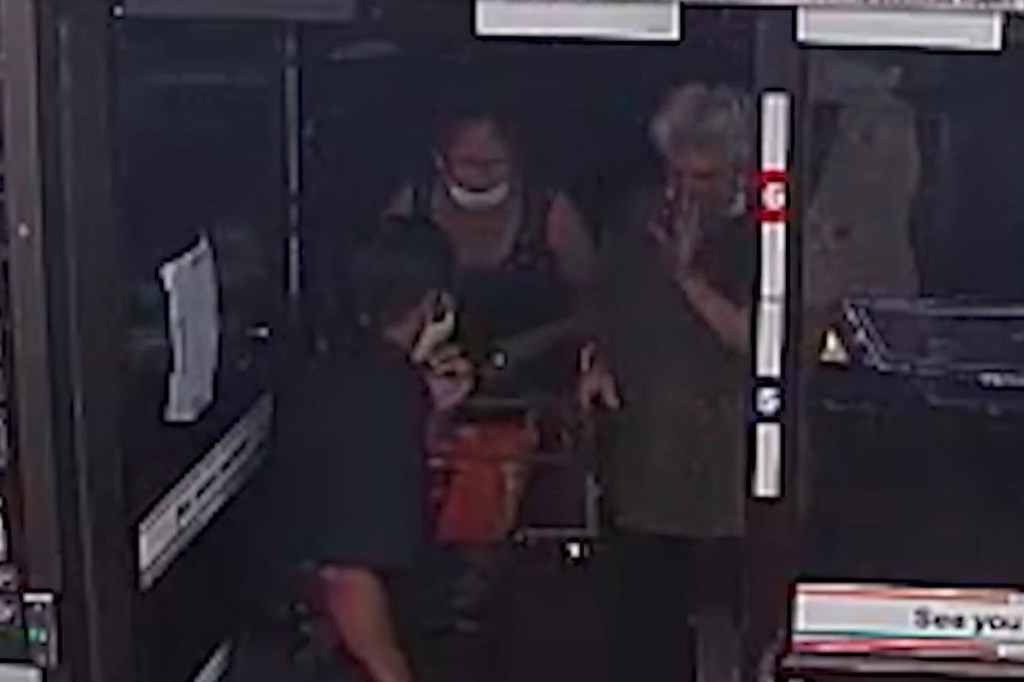 Thomas Martin attempts to enter the convenience store but is stopped by Mitchell.