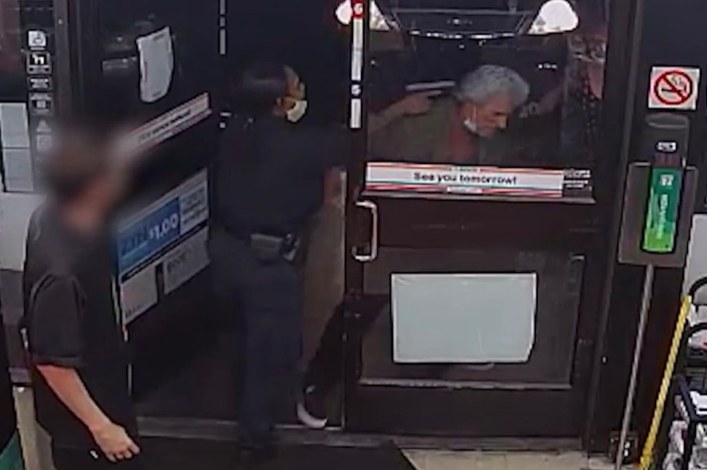 Kegia Mitchell holds a gun at Thomas Martin's head outside a Las Vegas 7-Eleven moments before shooting him on Aug. 26, 2020.