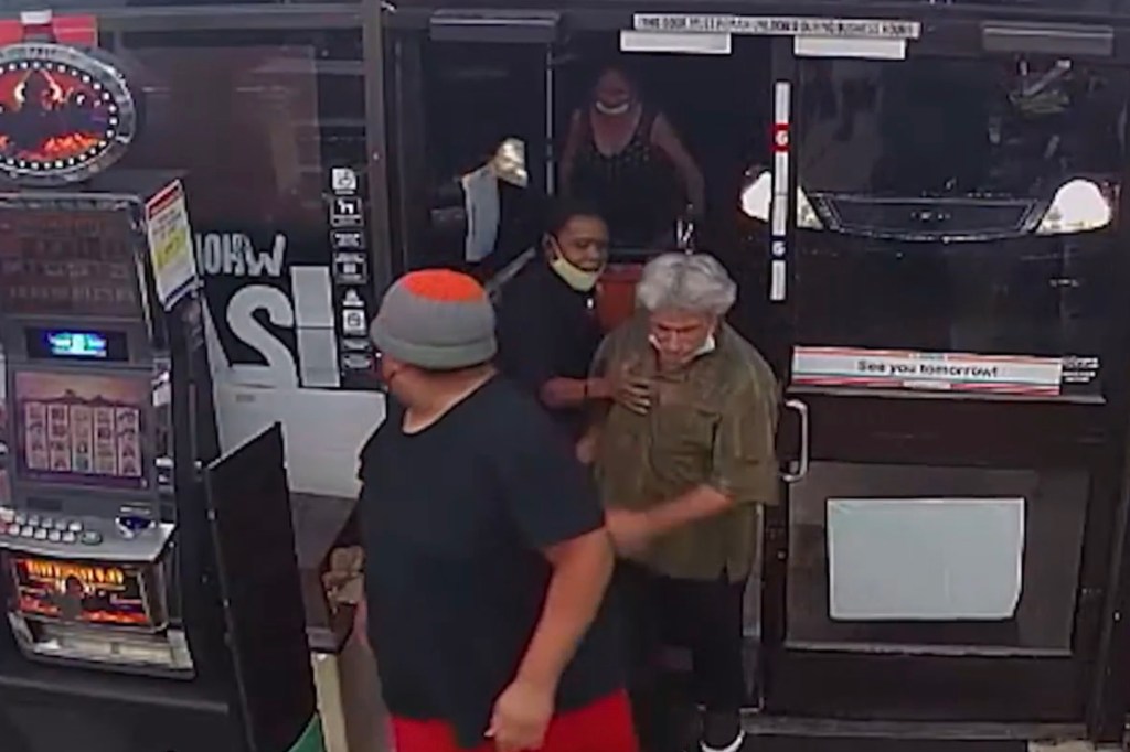 Martin breaks past Mitchell and into the store before the security guard grabs him.