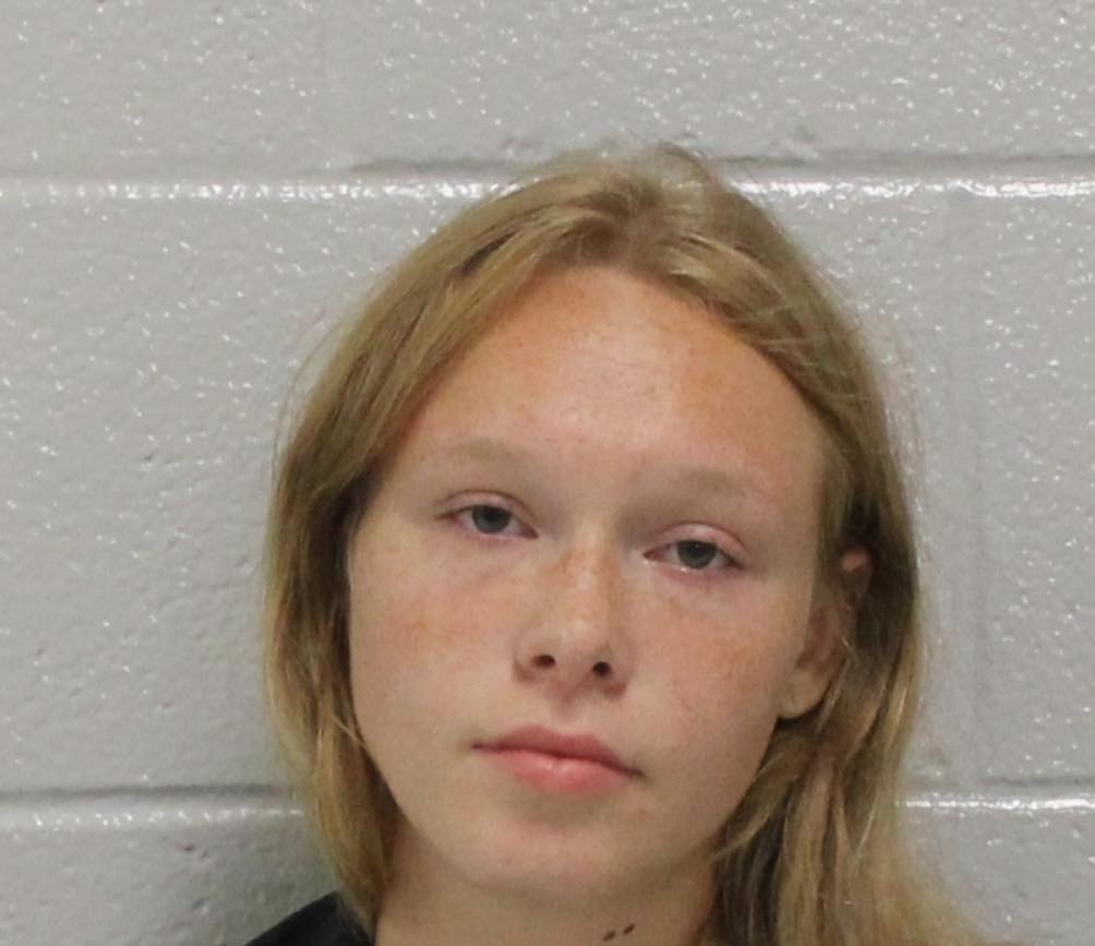 The 17-year-old turned herself in at the Carroll County jail on Tuesday after she was charged after she was charged with killing her church-going mother and stepfather.