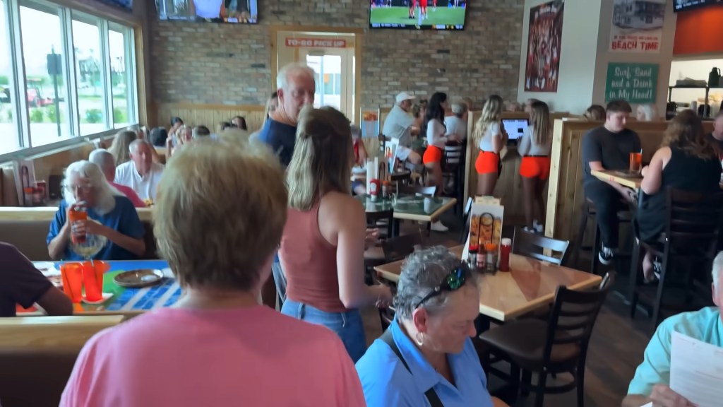 Hooters fans lined up early for the opening of the new restaurant in The Villages, an age-restricted community located about 45 miles northwest of Orlando.