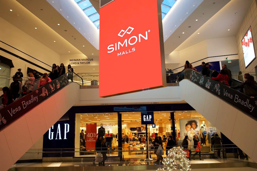FILE PHOTO: Shoppers ascend and descend escalators at the King of Prussia Mall, owned by Simon Property Group, United State's largest retail shopping space, in King of Prussia, Pennsylvania, U.S., December 8, 2018. Picture taken December 8, 2018. REUTERS/Mark Makela