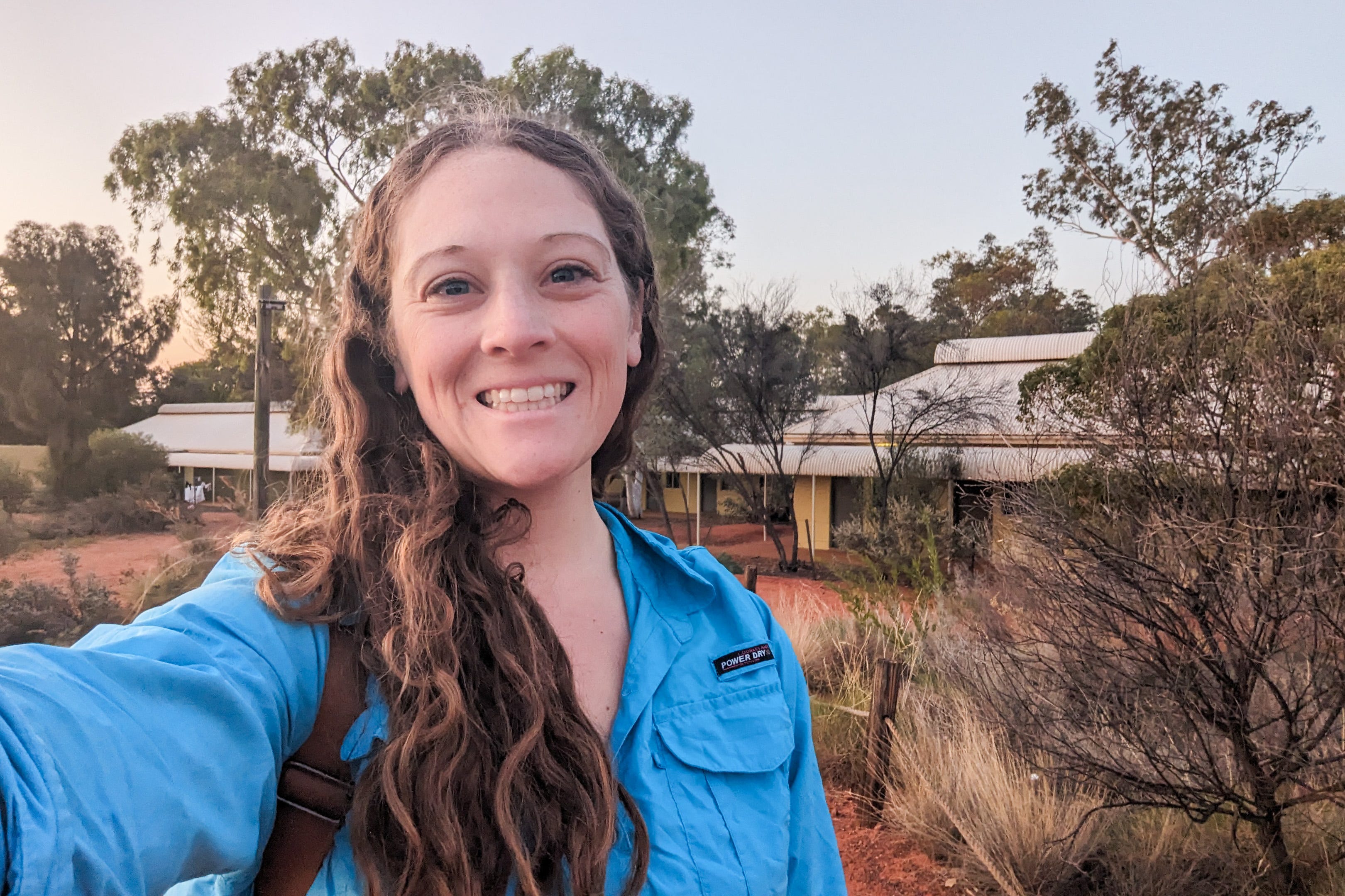Author Jenna DeLaurentis smiling in the Outback near hostel
