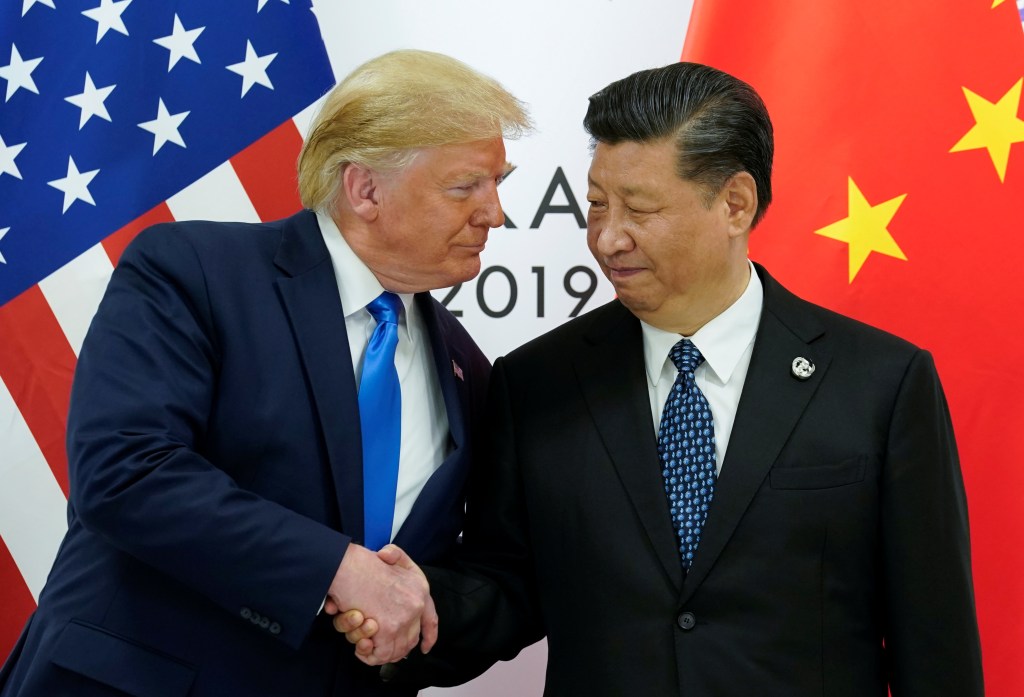President Trump and President Xi Jinping shaking hands at the G20 summit.
