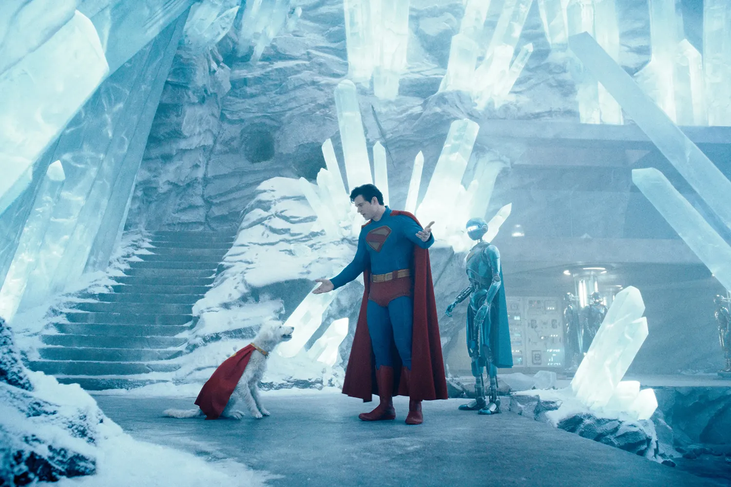 Superman in a film still with a dog wearing a cape and a robot.