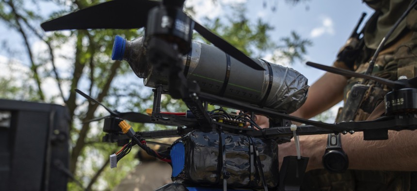 Ukrainian soldiers of the 93rd Brigade test a fiber-optic drone before going to the front lines in Donetsk Oblast, Ukraine, on June 17, 2025.