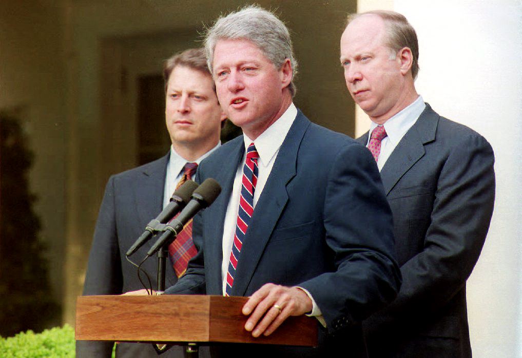 President Bill Clinton, Vice President Al Gore, and David Gergen at a press conference.