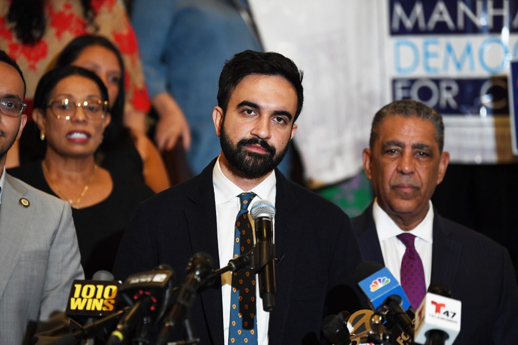 Photo of Zohran Mamdani at a press conference.