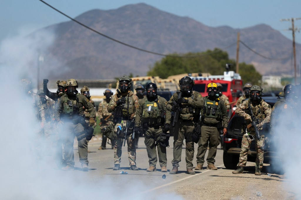 Federal agents and immigration officers in Camarillo, California during a raid.