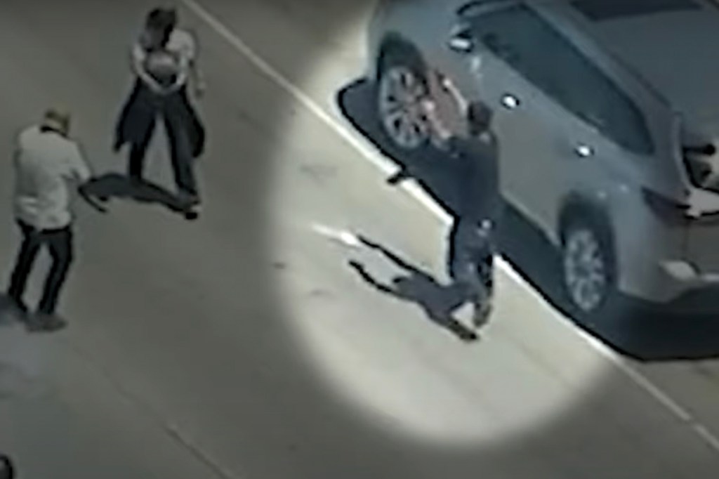 Protester appearing to fire weapon at immigration agents.