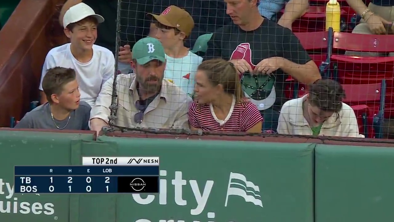 Ben Affleck Jennifer Garner and two of their kids at a baseball game. 