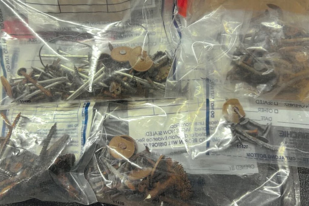 Bags of nails and screws seized as evidence.