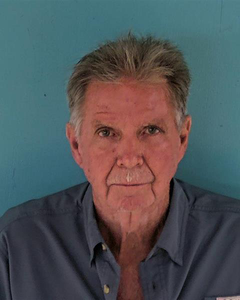 Mugshot of a man accused of sabotaging fire rescue vehicles.