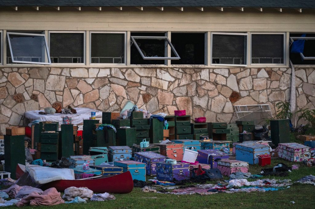 Campers' belongings outside cabins after a flash flood.