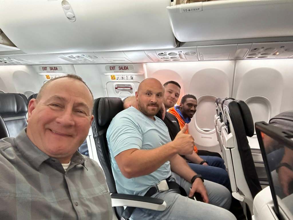 Four men on a plane.