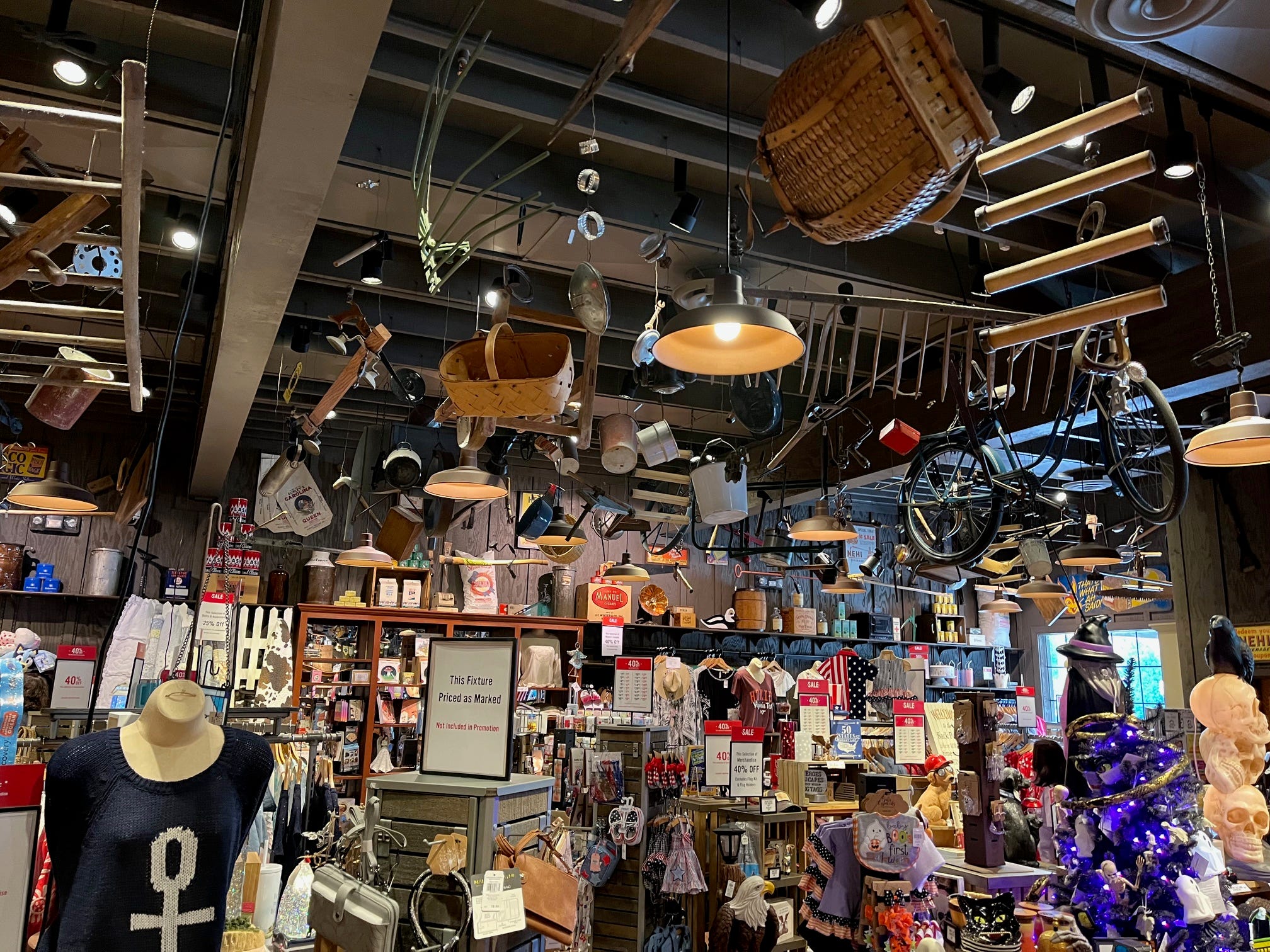 The gift shop at a Cracker Barrel store in Virginia, with antiques and other trinkets hanging from the ceiling.