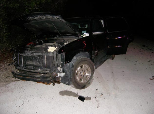 A wrecked Chevrolet Tahoe.