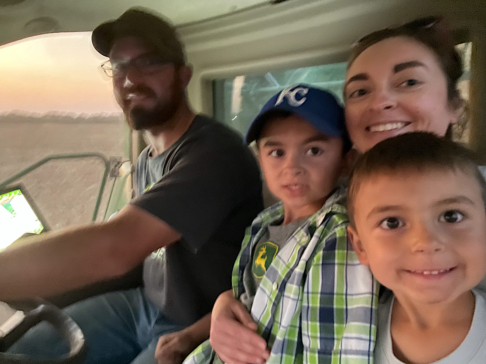 The author with her two kids and husband sitting in a car.