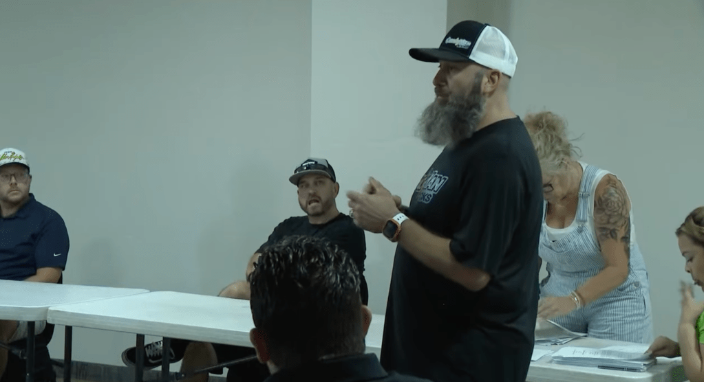 Martin speaks at the special homeowners meeting on July 10, 2025.