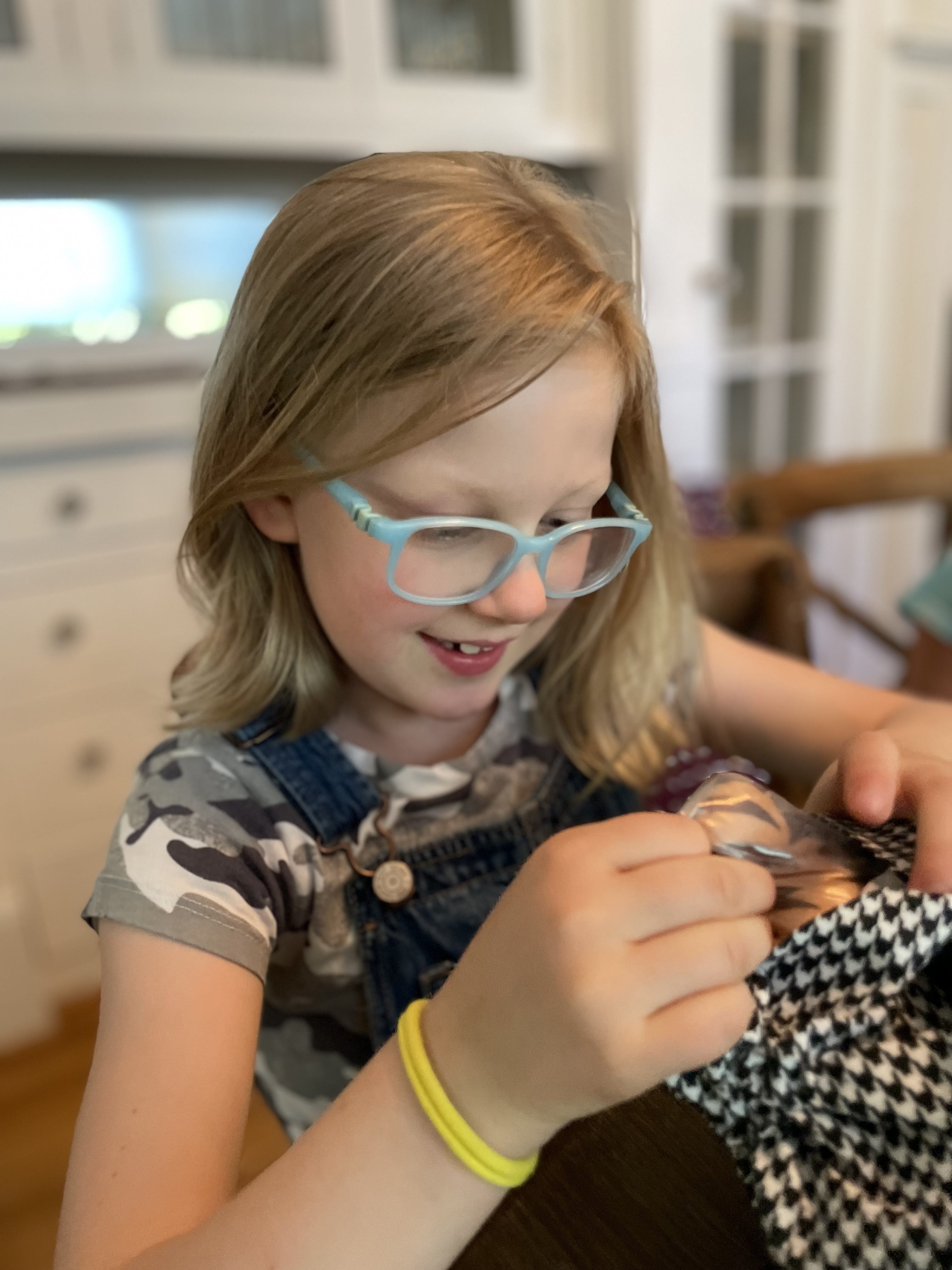 Brendan Knapp's daughter in blue glasses
