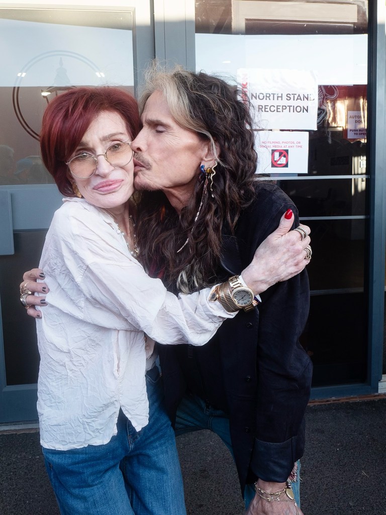 Aerosmith’s Steven Tyler lays a smooch on Sharon Osbourne at hubby Ozzy’s farewell concert in Birmingham, England, last weekend.