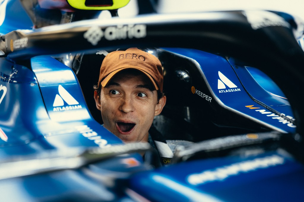 Tom Holland gets a taste of life in the fast lane sitting in a Formula 1 race car at the British Grand Prix.