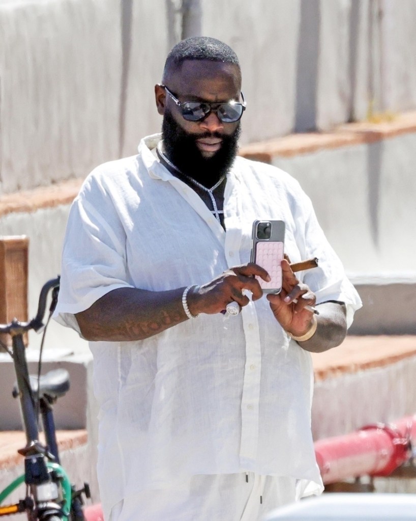 Rapper Rick Ross readies another cellphone pic while visiting Capri, Italy.