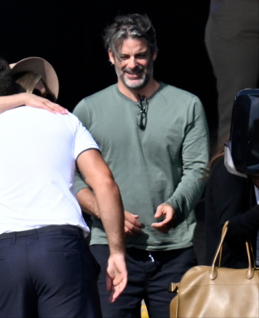 Jim Curtis in a khaki long-sleeved t-shirt and black pants.