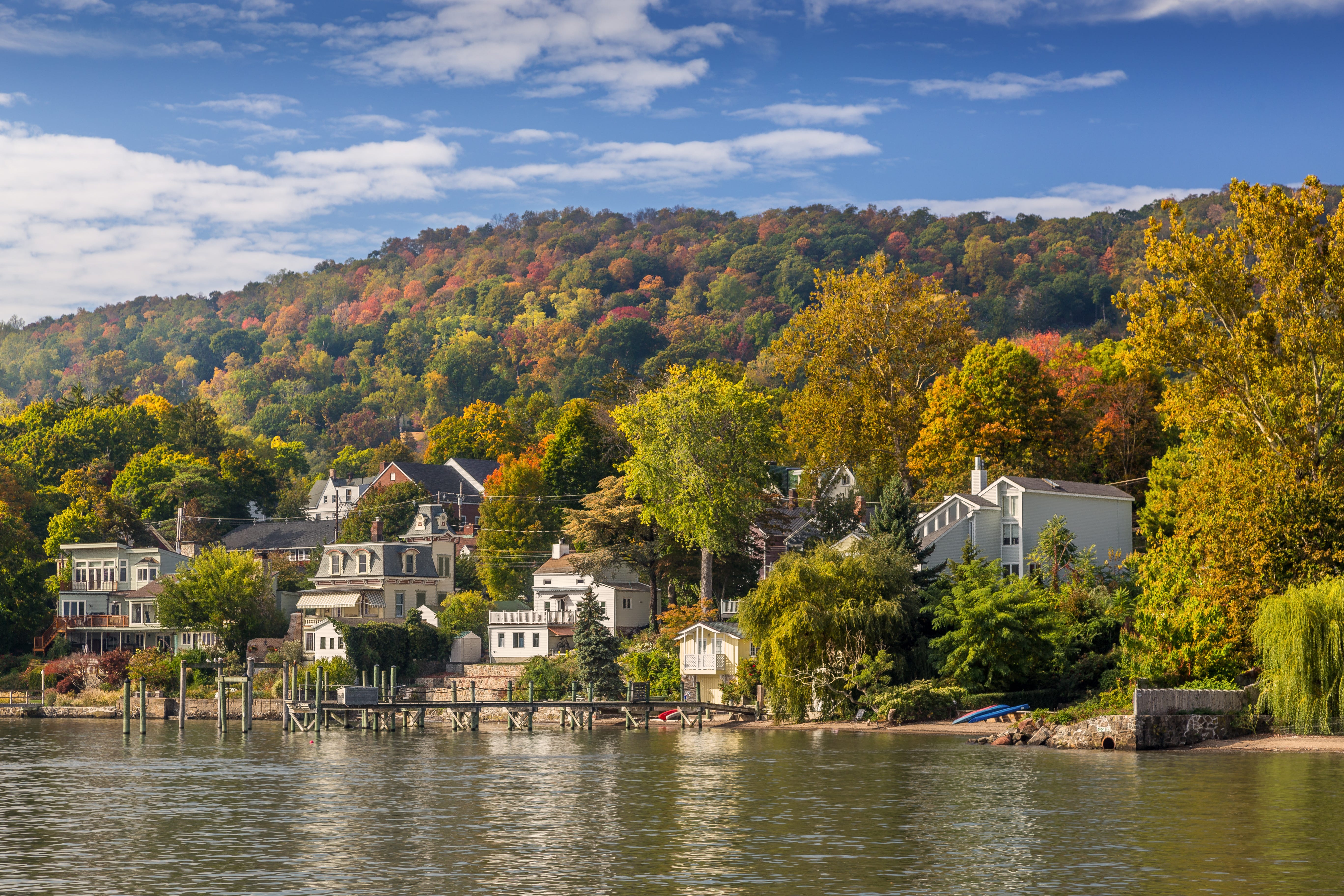 Houses and boat docs on the Hudson River in Hudson, New York.