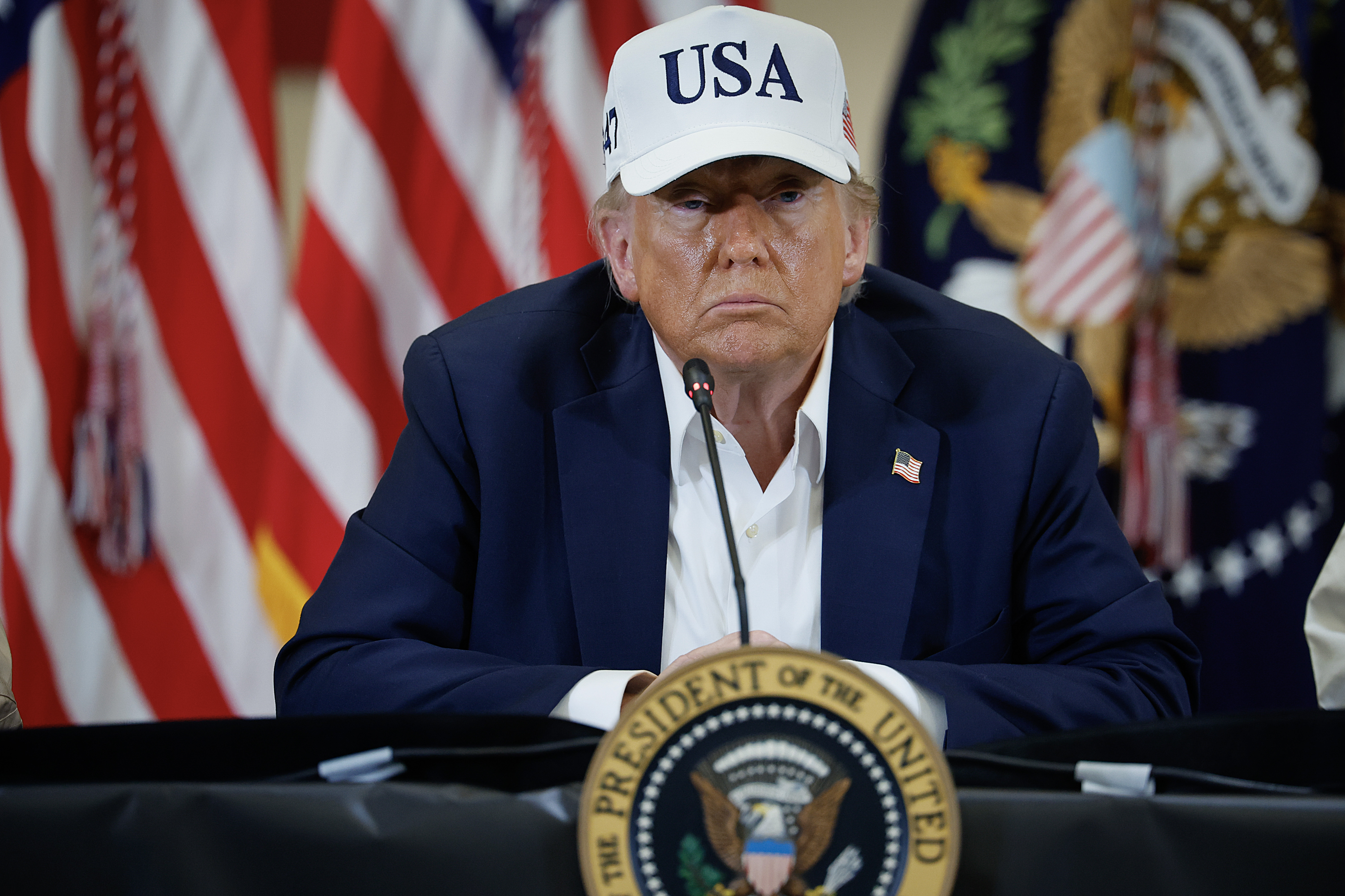 President Donald Trump with a white hat.