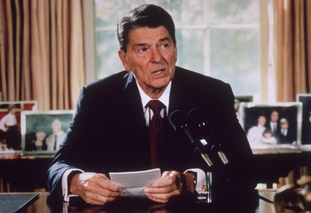 President Ronald Reagan making an announcement at his White House desk.
