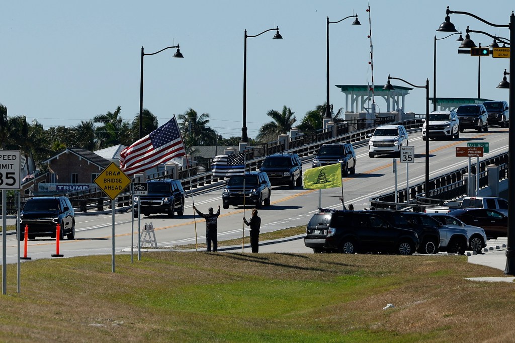 Motorcade crossing a bridge.