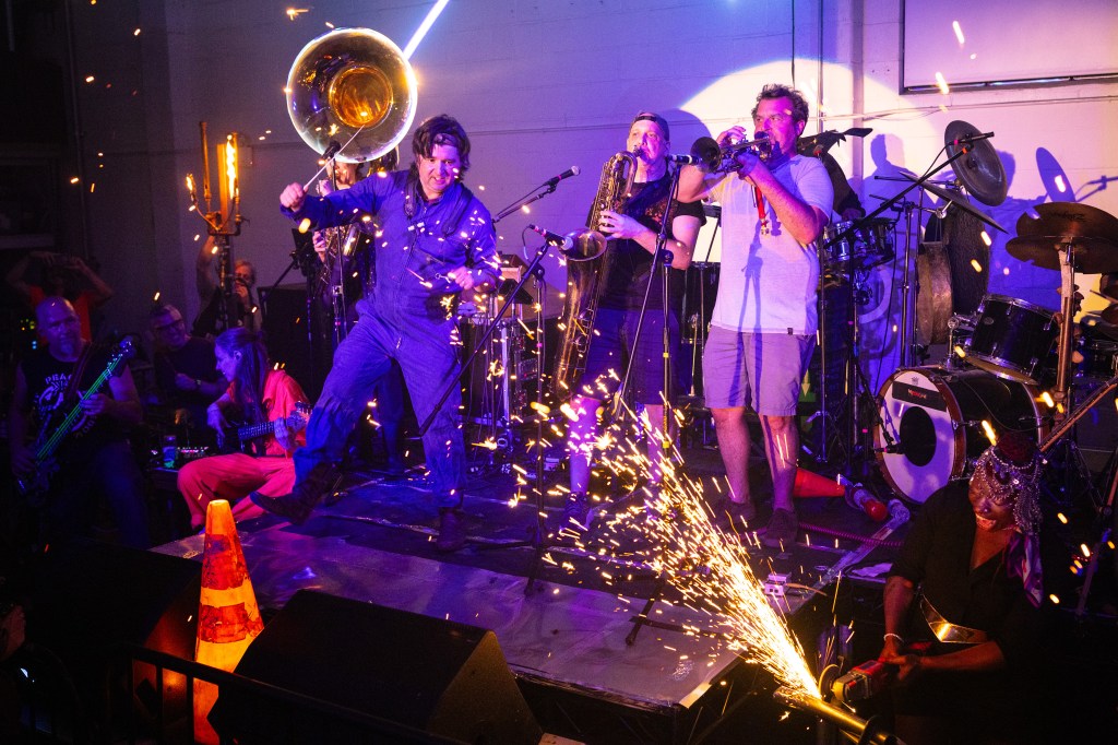 Brass band performing with sparks.