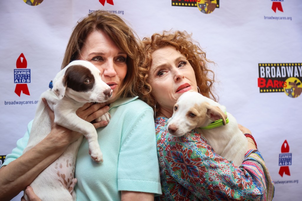 Beth Leavel and Bernadette Peters holding rescue dogs at Broadway Barks.