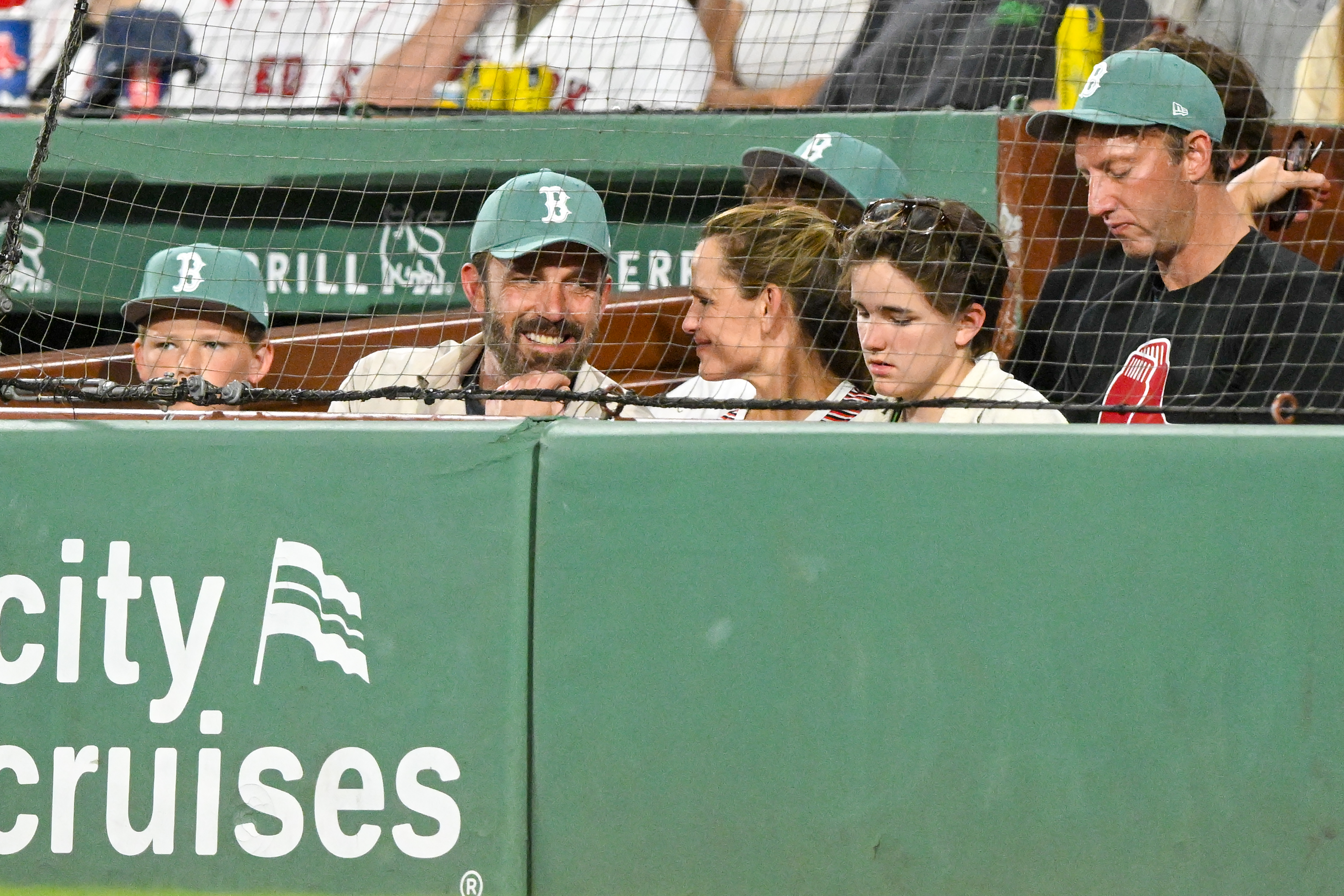Jennifer Garner and Ben Affleck with kids at a Red Sox game. 